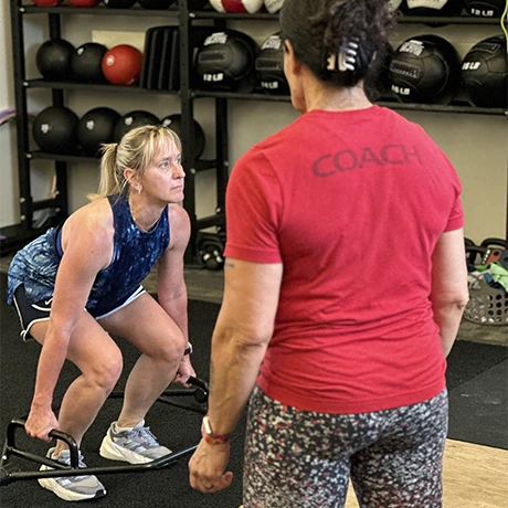 women training with her personal trainer at RTC Fitness